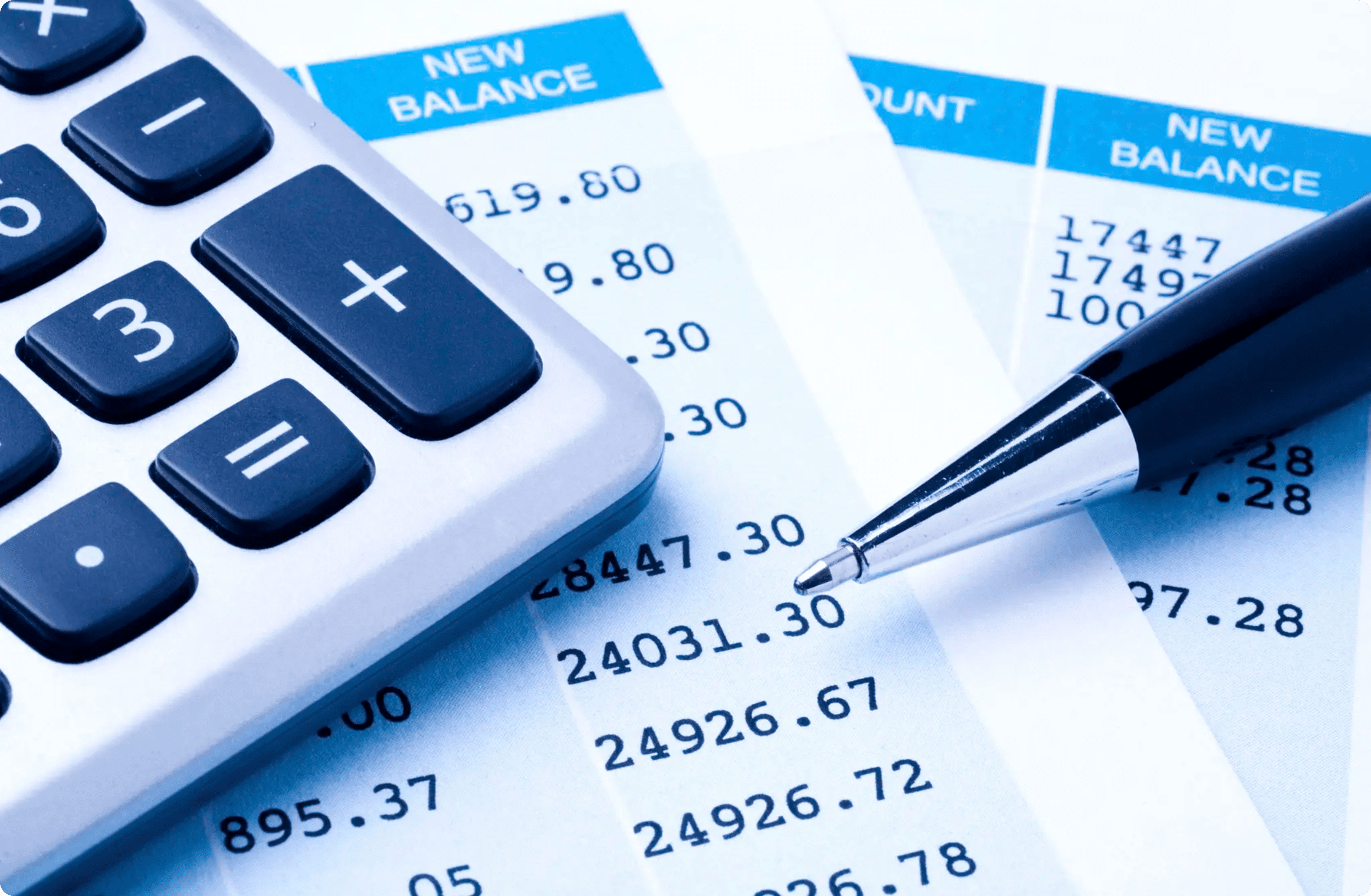 Financial statement with calculator and pen